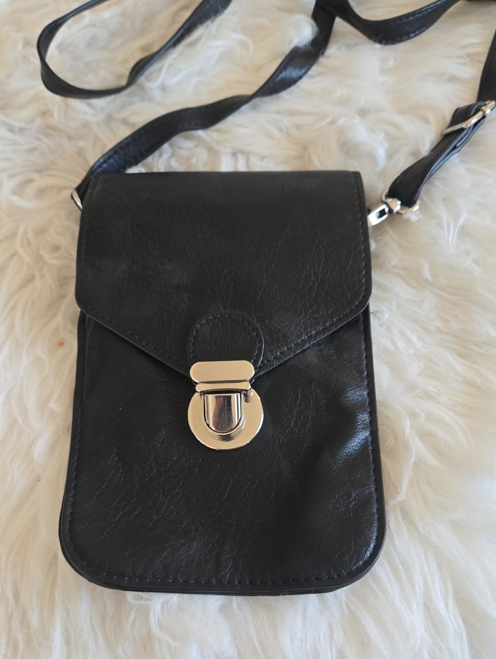 Sleek Black Crossbody Phone Bag with Silver Hardware